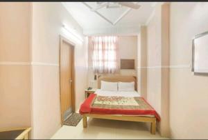Postel nebo postele na pokoji v ubytování Hotel Queen