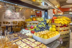a buffet of fruits and vegetables on a table at SOWELL RESIDENCES Chênes Verts in Saint-Raphaël
