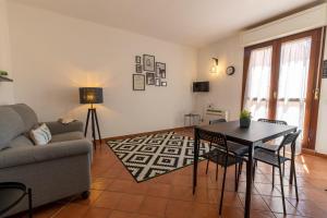 a living room with a couch and a table at Montenero - B in Olbia