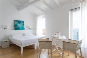 Postel nebo postele na pokoji v ubytování La Malà - camere di charme
