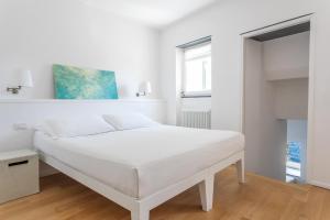 Postel nebo postele na pokoji v ubytování La Malà - camere di charme
