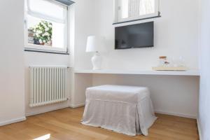 TV a/nebo společenská místnost v ubytování La Malà - camere di charme