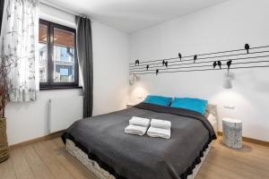 Posteľ alebo postele v izbe v ubytovaní Apartament Scandinavia