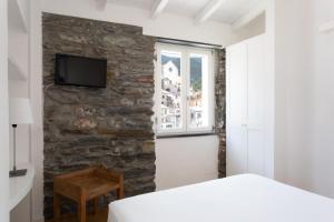 Postel nebo postele na pokoji v ubytování La Malà - camere di charme
