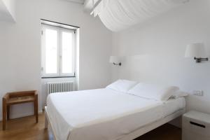Postel nebo postele na pokoji v ubytování La Malà - camere di charme