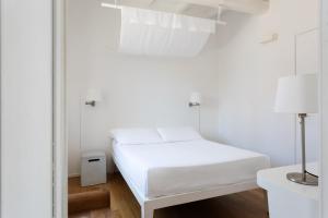 Postel nebo postele na pokoji v ubytování La Malà - camere di charme