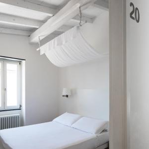 Postel nebo postele na pokoji v ubytování La Malà - camere di charme