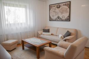 a living room with a couch and a coffee table at House Marin - whole house in Maribor