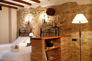 A bed or beds in a room at Complejo Rural Turimaestrat