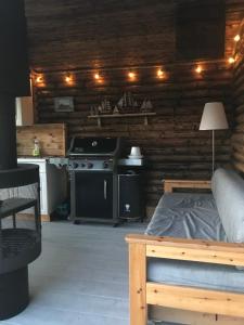 a bedroom with a stove and a bed in a room at Villa Muikkupolku in Kokkola +20 photos