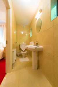 a bathroom with a sink and a toilet at Aisleigh Guest House in Carrick on Shannon