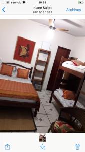a bedroom with two bunk beds and a ladder at Suite de Lane e Mu in Abraão