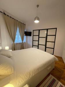 Кровать или кровати в номере Interbellic Flat