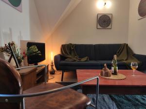 a living room with a couch and a table at Serce miasta in Kazimierz Dolny