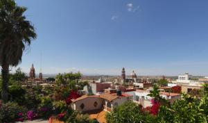 
a large building with a large clock tower at Casa Mia Suites in San Miguel de Allende
