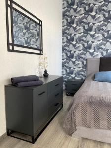 Ένα ή περισσότερα κρεβάτια σε δωμάτιο στο Stylish Apartment