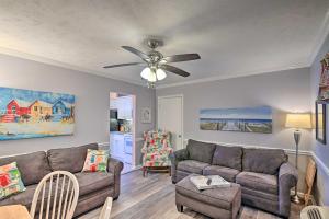 a living room with a couch and a ceiling fan at Beach Condo with Pool Access, 1 Block to the Ocean! in Myrtle Beach
