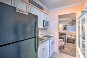 a kitchen with a refrigerator with a no smoking sign on it at Beach Condo with Pool Access, 1 Block to the Ocean! in Myrtle Beach