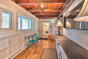 a kitchen with a table and chairs in a room at Pet-Friendly Gilford Home by Gunstock Ski Mountain in Gilford