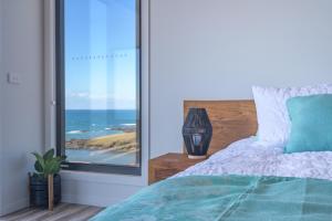 The Cove Tasmania客房内的一张或多张床位