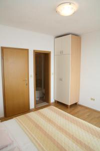 En eller flere senger på et rom på Apartments Davor & Marija Sosic