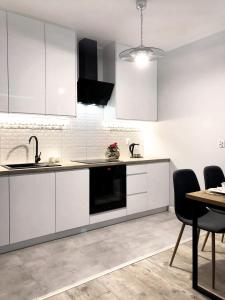 Kuchyňa alebo kuchynka v ubytovaní Apartament Stare Miasto