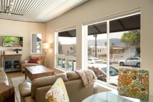 a living room with a couch and a large window at 90 San Luis Street Unit A in Avila Beach