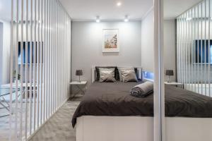Posteľ alebo postele v izbe v ubytovaní Nowoczesny apartament Gliwice - 200 metrów od rynku