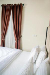 Rúm í herbergi á Ocean Park Hotel,Lekki phase 1