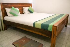 Tempat tidur dalam kamar di Thidasa Holiday Resort