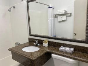 a bathroom with a sink and a mirror at The Pacific in San Diego