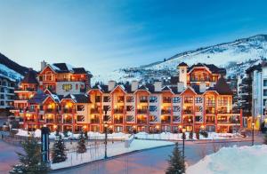 a resort in the mountains with snow at Ski In, Ski Out 2 Bedroom Vacation Rental In The Heart Of Lionshead Village With Heated Slope Side Pool And Hot Tub in Vail