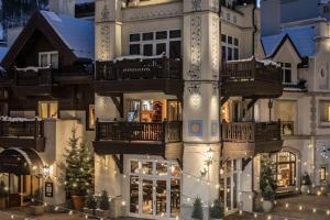 a large building with balconies on the side of it at Platinum 4 Bedroom Vacation Rental In The Heart Of Vail That Includes Ski Valet, Ski Deck, Rooftop Pool, Panoramic Views in Vail