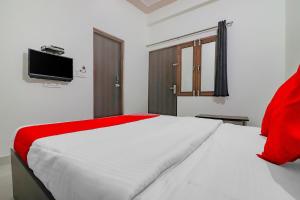 Postel nebo postele na pokoji v ubytování Rajlakshmi Guest House