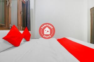 Postel nebo postele na pokoji v ubytování Rajlakshmi Guest House