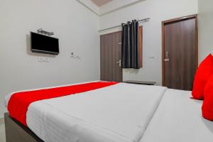 Postel nebo postele na pokoji v ubytování Rajlakshmi Guest House