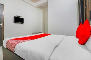 Postel nebo postele na pokoji v ubytování Rajlakshmi Guest House