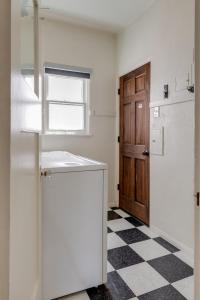 a kitchen with a black and white checkered floor at Visit the Beach from a Historic Downtown Apartment - NRP21-00092 in Long Beach +40 photos