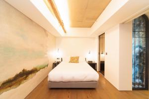 Hotel Museo Cheongju客房内的一张或多张床位