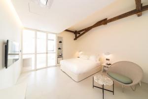 Hotel Museo Cheongju客房内的一张或多张床位