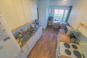 a kitchen with a sink and a counter top at Bondo OuluPaalikatu Rate145 PrivateRoom-YksityinenHuone-ЛичнаяKомната into Centre-University-BusTrainStation,Sauna in Oulu