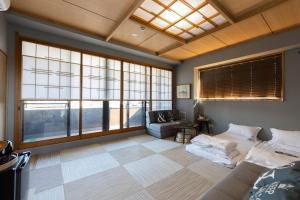 Postel nebo postele na pokoji v ubytování 灯光旅館 Light hotel
