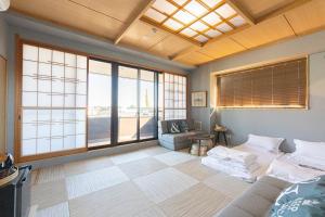 Postel nebo postele na pokoji v ubytování 灯光旅館 Light hotel