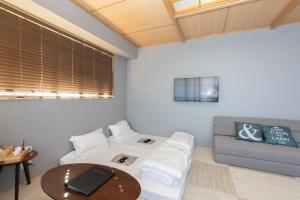 Postel nebo postele na pokoji v ubytování 灯光旅館 Light hotel