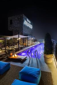 a resort with a swimming pool at night at Hotel Museo Cheongju in Cheongju
