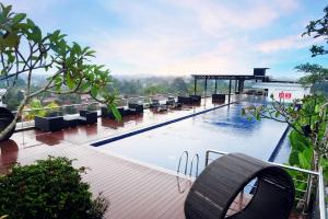 a large swimming pool on top of a building at INNSiDE by Meliá Yogyakarta in Yogyakarta
