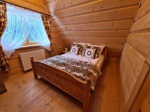 מיטה או מיטות בחדר ב-Alpinka
