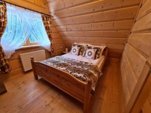 Posteľ alebo postele v izbe v ubytovaní Alpinka