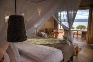 Tempat tidur dalam kamar di Manyara's Secret
