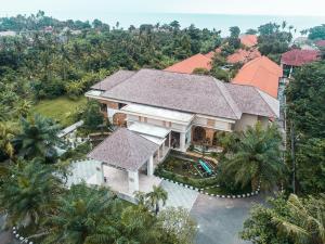 an aerial view of a house with a roof at New Sunari Lovina Beach Resort in Lovina